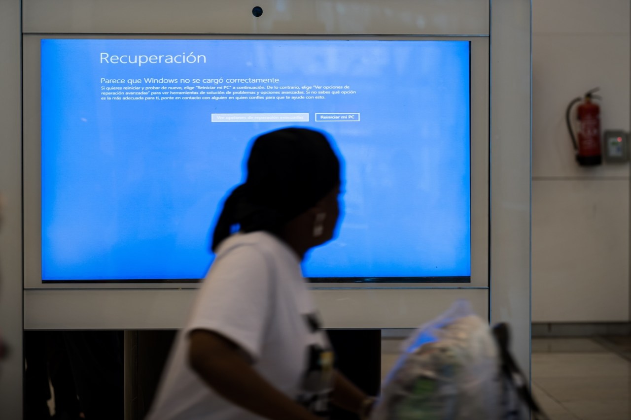 A general view from Madrid-Barajas International Airport as passengers gather and wait due to the global communications outage caused by CrowdStrike, which provides cyber security services to US technology company Microsoft