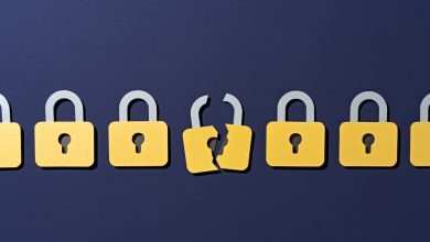 Paper Craft of a Cracked Yellow Padlock in a Group of Secure Ones on Purple Background Front View, Data Security Concept.