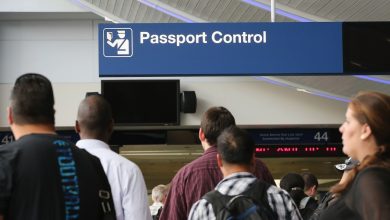 International travelers wait to have their passports checked at O'Hare International Airport on September 19, 2014 in Chicago, Illinois