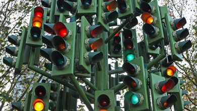 A confusing traffic light system with multiple signal heads.